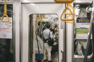 subway train commuters inside going work