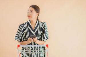 portrait beautiful young asian woman with shopping cart